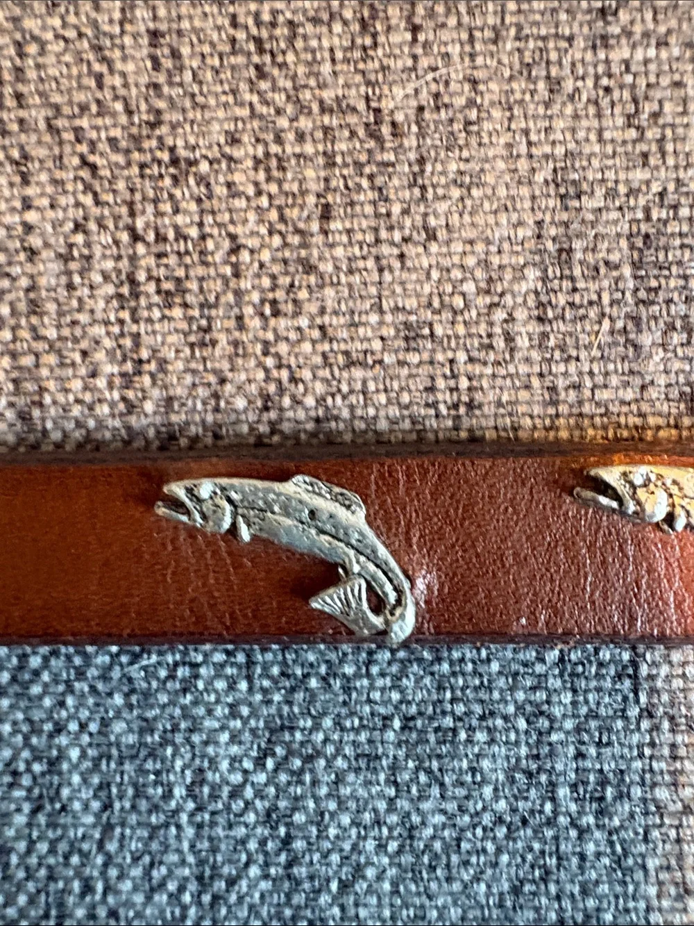 Hatband sterling silver trout on brown leather.